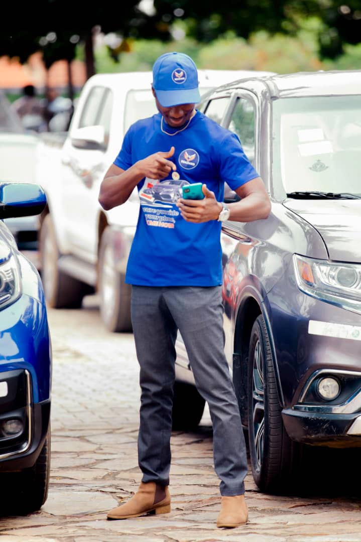 Boasiako team member checking a tracked vehicle on a smartphone